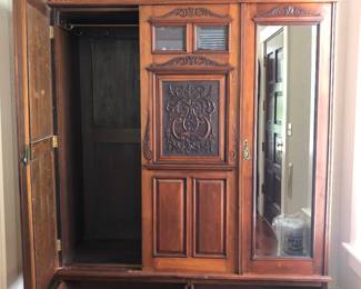 Antique Armoire provides nice storage or closet option.