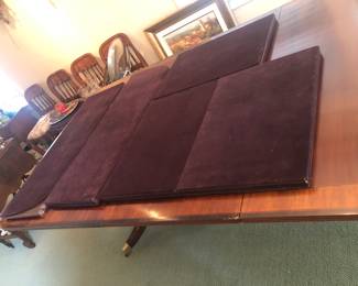 Dining table comes with protective custom table top pads.