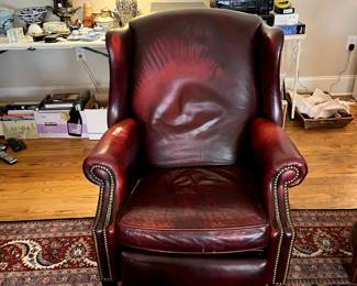 #49 red leather as is recliner wing back chair with nail heads $30.00