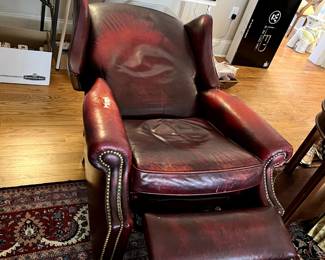 #49 red leather as is recliner wing back chair with nail heads $30.00