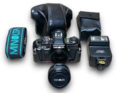 Minolta 35mm SLR Film Camera Model: X-570 w/ A Minolta MD 50mm 1:1.7 Lens And A Minolta Auto 280 PX Flash