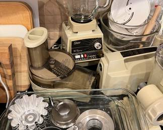 Assorted Kitchen: Oster Blender, Pyrex Measuring Cups, Hamilton Beach Milkshake Machine, Black & Decker Electric Knife, Kenmore Hand Mixer, Keurig Coffee Machine, Bakeware and more...