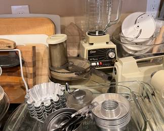 Assorted Kitchen: Oster Blender, Pyrex Measuring Cups, Hamilton Beach Milkshake Machine, Black & Decker Electric Knife, Kenmore Hand Mixer, Keurig Coffee Machine, Bakeware and more...