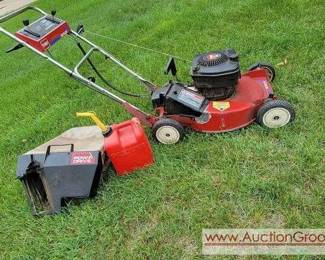 TORO Recycler Self Propelled Lawnmower with bag and gas can.