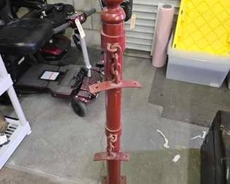 #1994 • Red Metal Floor Mount Hitching Post Pole with 2 Chain Mounts.
