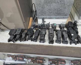 #50620 • (18) CastIron Vehicles & A Cast-iron Scale, Pot, & more
