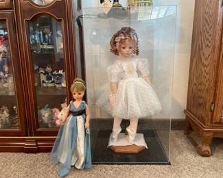 #60094 • 2 Dolls on Stands and one in a Display Case
