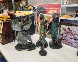#1634 • 4 Bronze Statues

