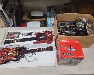 #1510 • PS2 Guitar Controllers, PS2 Games, and Logictech Wingman Attack Controller
