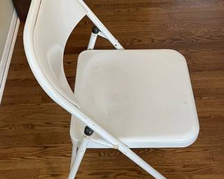 Set of four folding chairs.