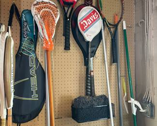 Tennis rackets and cleaning supplies.