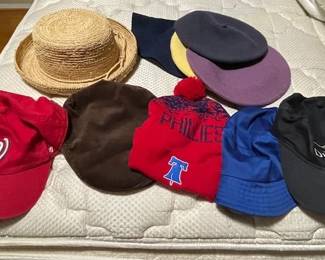 Baseball caps and straw hats.