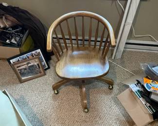 Wooden chair on wheels.