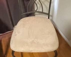 Metal chairs with upholstered seat.