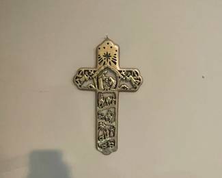 Small decorative cross.