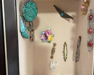 Pins and brooches.