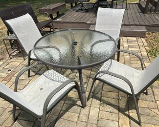 Round table and four chairs patio set.