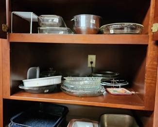 assorted Pyrex, Fire King, corning ware, and roasting pans.