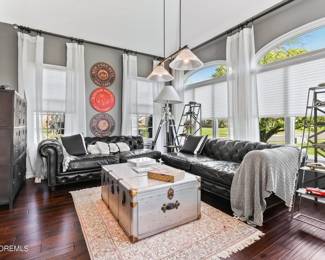 13.  RH Black Leather Sectional (Separated in Photo) $9000.00  and also RH Trunk Cocktail Table $1600.00