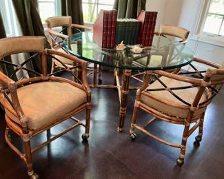 McGuire furniture, bamboo table with beveled glass. 4 bamboo &  upholstered club chairs on  casters