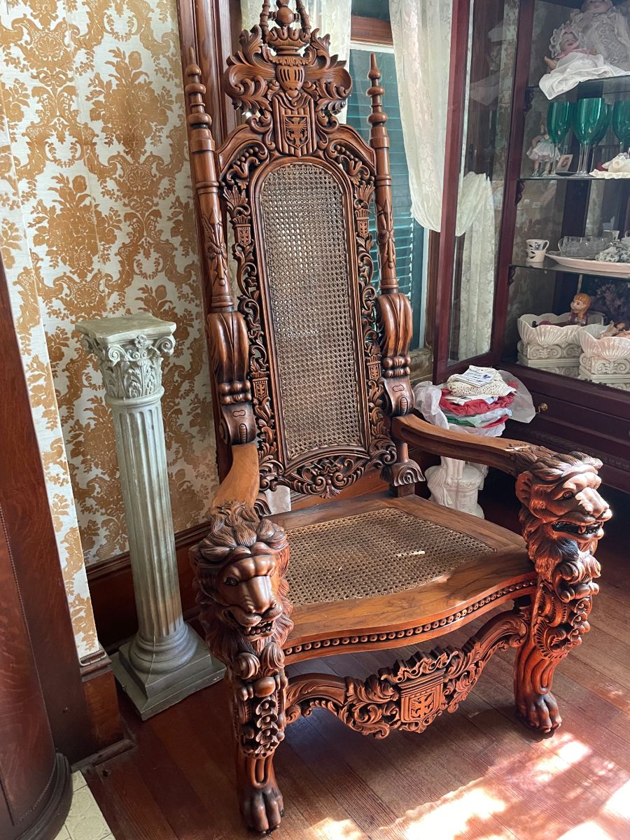 The Kings Chair, carved Lions head, Cane seat and Back.