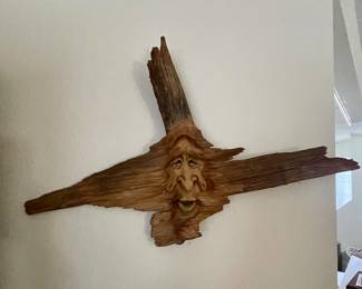 driftwood carved face