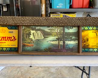 Large Hamm's beer sign with moving scene.