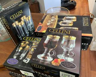 several boxes of crystal glassware