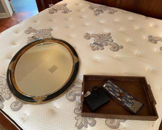 Black and gold oval mirror