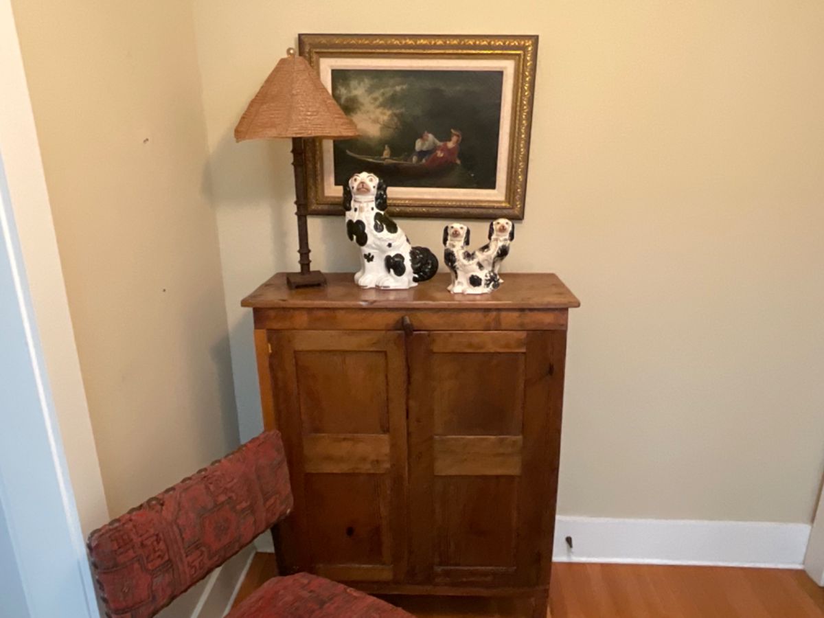 2 Authentic Staffordshire Dogs from England that are incredible, sitting on a Wonderful Antique Jelly Cabinet and A fabulous Oil on Canvas.