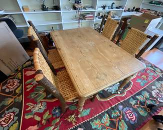 Primitive Table with 4 Chairs sitting on a Beautiful Hand Tied Rug.
