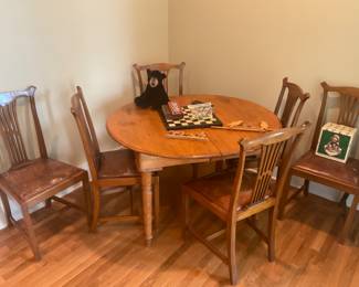 Great Table with 6 Leather Bottom chairs. 