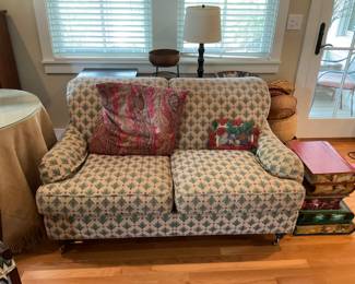 Small Sofa and a cute Book Table with opening top with a Great Sofa Table with Lamp and Decor behind it.