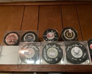 Signed hockey pucks