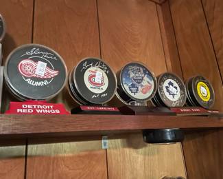 Signed hockey pucks