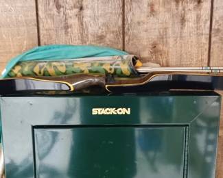 top of the gun cabinet, the bow and a quiver