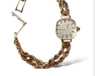 14k Lucien Piccard Solid Gold watch with sapphire cabochon bezel 
24.95 grams