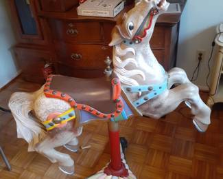 Carousel Horse mounted on steel and cast iron base.
Horse is 40" long, on mount 46" tall. 3 leg base is 24".