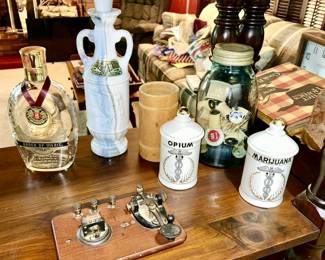 Morse code telegraph key pad, decanters, aqua glass jar w/ wooden spools, vintage Opium & Marijuana covered containers (SOLD)