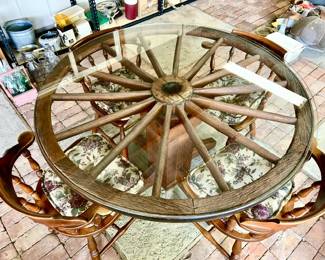 Top view of Wagon wheel table with wooden base and glass top