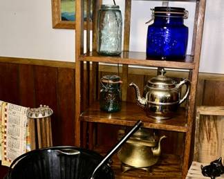 Arts & Crafts book shelf, coal bucket, vintage teapots, cobalt blue glass, McCoy vase (top shelf), glass lamp, etc.
