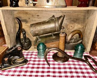 Antique cast iron seal, glass insulators, antique sad irons, antique hook, wooden spool, etc. (SOME SOLD)