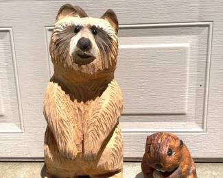 GRLI206 Wood Carving Raccoon Beaver Hand carved wooden raccoon. Looks to have glass eyes. Also a small wooden carved beaver.
