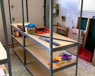 GRLI213 Metal Storage Shelving #2	&nbsp;A pair of metal storage shelves. Comes with a few extra metal pieces, has wood decking. Metal pieces look to be thin.
