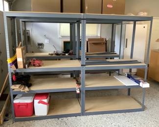  GRLI212 Metal Storage Shelving #1	A pair of grey metal shelves with a few extra metal pieces. Metal pieces are thin and come with wood decking.&nbsp;
