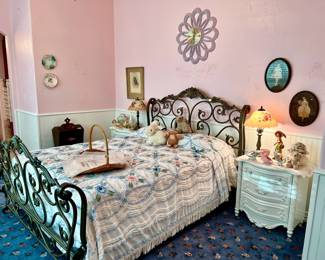 SUPER SWEET PINK ROOM WITH CHENILLE BEDSPREAD, METAL BED AND TWO NIGHTSTANDS.