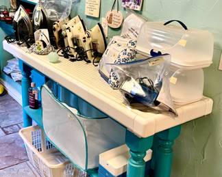 LARGE LAUNDRY ROOM WITH SO MANY CLEANING SUPPLIES, VACUUMS, FLOOR CLEANERS, ETC.