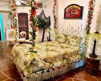 TIKI ROOM.  NOTICE THE TIKI NIGHTSTANDS, PALM TREE AND COCONUT LAMPS, AND THE SWINGING BED!!