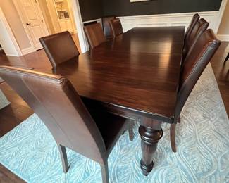 8 leather side chairs are priced separately