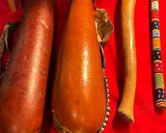 Vintage gourd water bottles with beadwork and fossilized bone club moved to jewelry table